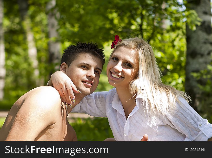 Fashionable romantic young couple outdoors in the park.