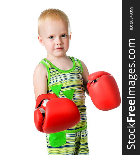 Little boy in red boxing gloves on white background