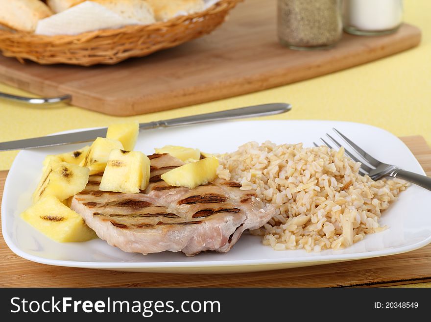 Grilled pork loin and pineapple with rice. Grilled pork loin and pineapple with rice