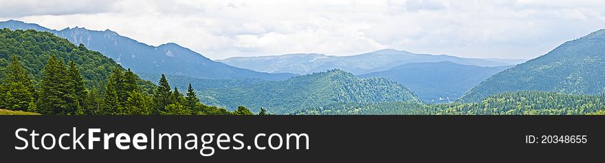 Panorama background in Carpathians. Beautiful montains and landscape in Romania.