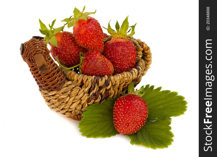 Fresh strawberries in a pretty basket on a white background. Fresh strawberries in a pretty basket on a white background