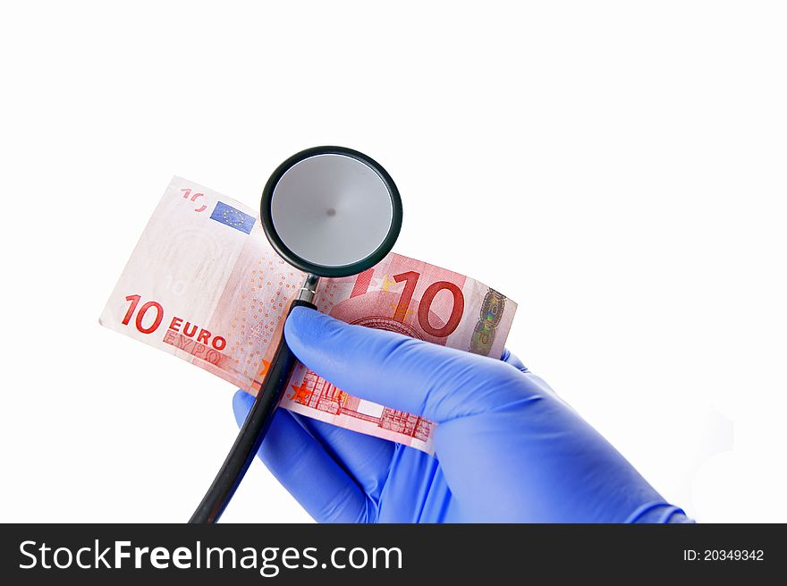 A hand with stethoscope and ten euro. A hand with stethoscope and ten euro
