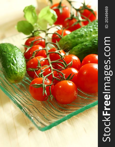 Fresh tomatoes and cucumber on plate