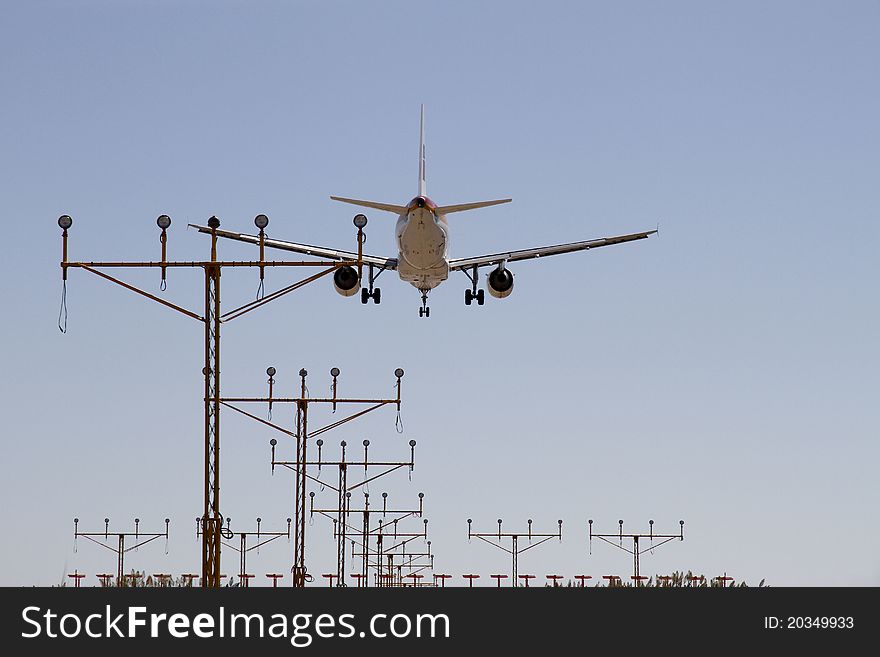 Plane in approach in blue sky. Plane in approach in blue sky