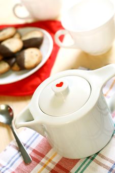 Teapot With Red Heart, Cup And Cookies Royalty Free Stock Photos