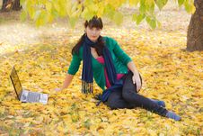 Young Girl With A Laptop In A Autumn Foliage Stock Images Young Girl With A Laptop In A Autumn Foliage Stock Images