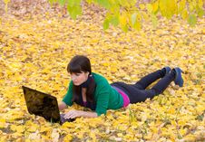 Young Girl With A Laptop In A Autumn Foliage Stock Photo Young Girl With A Laptop In A Autumn Foliage Stock Photo