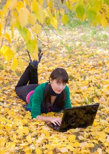 Young Girl With A Laptop In A Autumn Foliage Stock Image Young Girl With A Laptop In A Autumn Foliage Stock Image