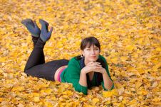 Girl Resting On Yellow Autumn Leaves Stock Photos Girl Resting On Yellow Autumn Leaves Stock Photos