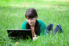 Beautiful Girl Lying In The Grass With Laptop Stock Photo Beautiful Girl Lying In The Grass With Laptop Stock Photo
