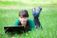 Beautiful Girl Lying In The Grass With Laptop Royalty Free Stock Photography Beautiful Girl Lying In The Grass With Laptop Royalty Free Stock Photography