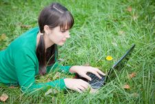 Beautiful Girl Lying In The Grass With Laptop Stock Photography Beautiful Girl Lying In The Grass With Laptop Stock Photography