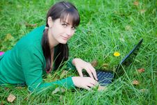 Beautiful Girl Lying In The Grass With Laptop Royalty Free Stock Image Beautiful Girl Lying In The Grass With Laptop Royalty Free Stock Image