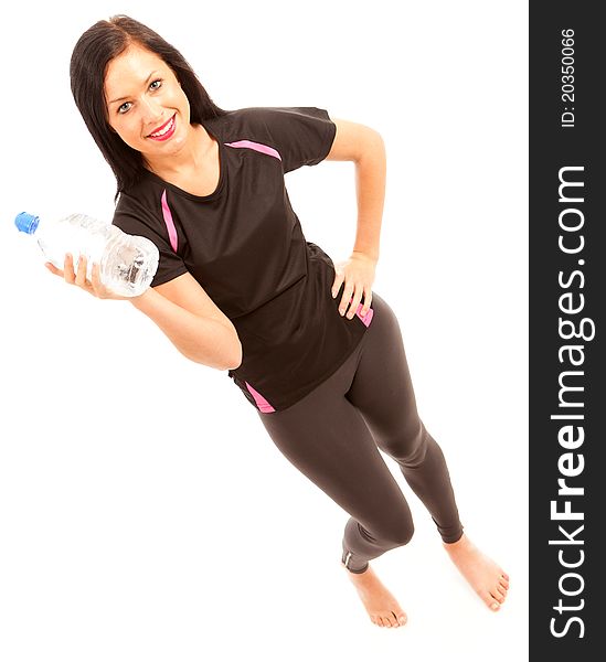 A young female dressed in gym wear holding a water bottle. A young female dressed in gym wear holding a water bottle