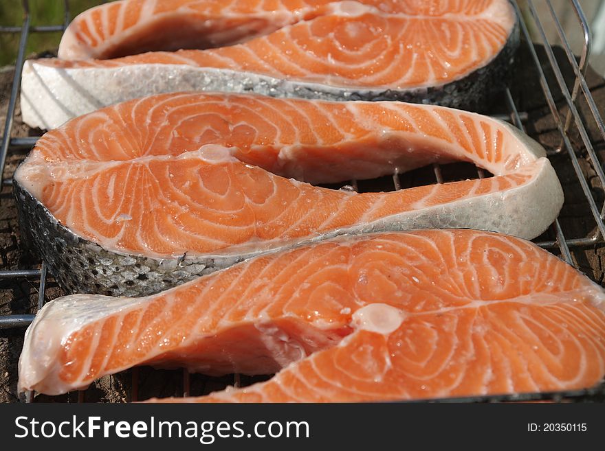 Pieces of salmon for cooking steaks on the grill. Pieces of salmon for cooking steaks on the grill