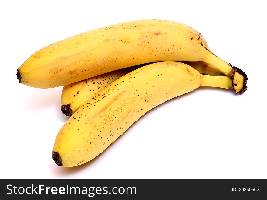 Color photograph of bananas on white background