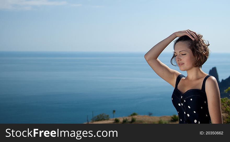 Outdoor shot of the young beautiful smiling woman. Outdoor shot of the young beautiful smiling woman