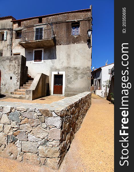 Village house with stone wall courtyard in France