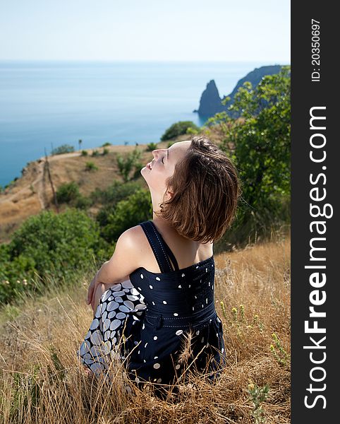 Outdoor shot of the young beautiful smiling woman. Outdoor shot of the young beautiful smiling woman