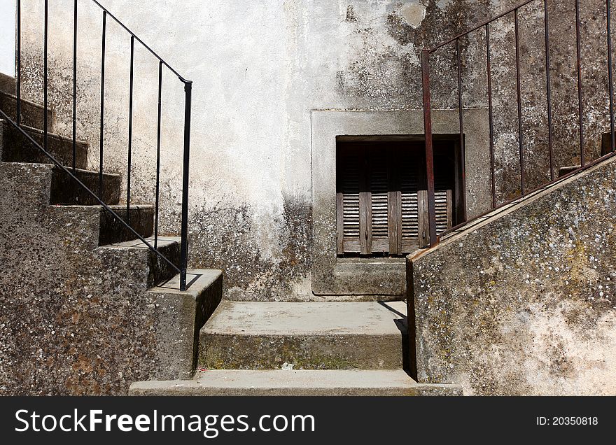 Two concrete stairways with steel handle bars going left and right. Two concrete stairways with steel handle bars going left and right