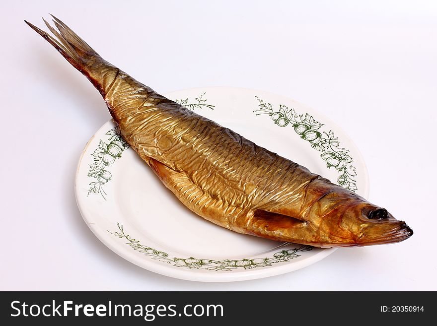 Color photo of a herring on dish. Color photo of a herring on dish