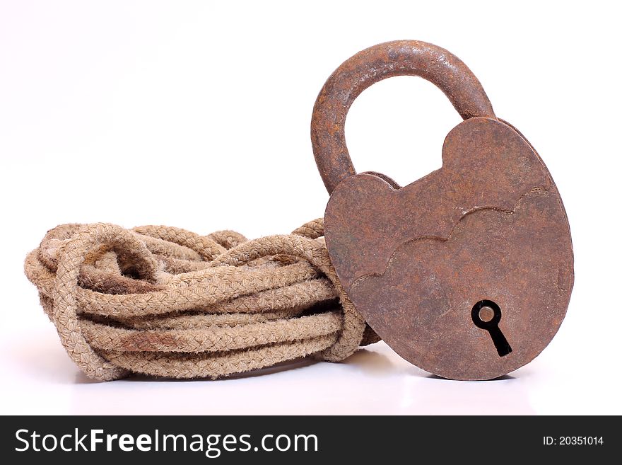 Color photo of coils of rope and a lock. Color photo of coils of rope and a lock