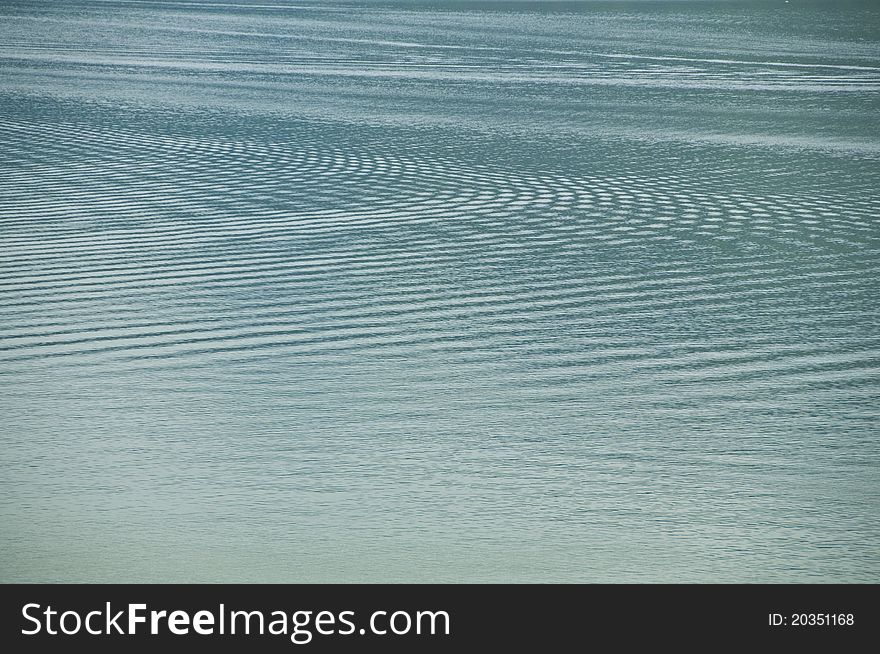 A wave from many boats in the lake. A wave from many boats in the lake.