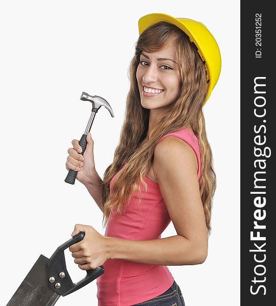 Portrait of a Young Lady with a hard hat saw and hammer. Portrait of a Young Lady with a hard hat saw and hammer