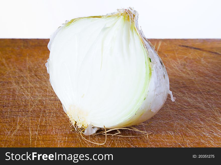 Closeup of half bulb of onion on the table