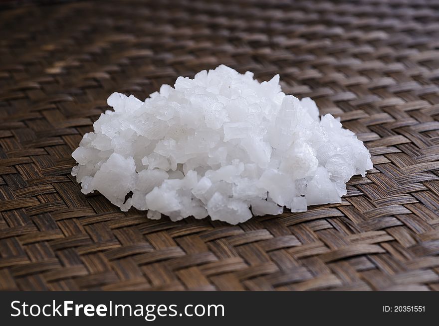 Close up Sea salt on weaving bamboo