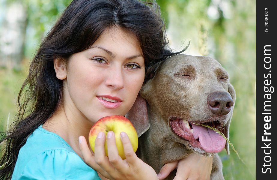 Young smiling woman and dog. Young smiling woman and dog