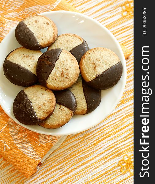 Cookies with chocolate on white plate. Cookies with chocolate on white plate