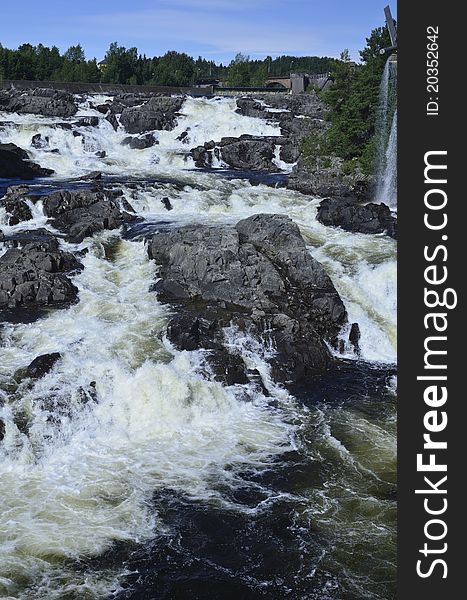 The River Begna forms the spectacular waterfalls of Hoenfossen Falls. The falls are situated at Hoenfoss, a little town of about 14,000 inhabitants in the Buskerud county of Norway. The River Begna forms the spectacular waterfalls of Hoenfossen Falls. The falls are situated at Hoenfoss, a little town of about 14,000 inhabitants in the Buskerud county of Norway.