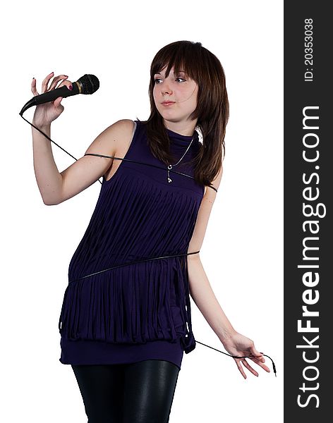 Cute girl wrapped in cord microphone on a white background. Cute girl wrapped in cord microphone on a white background