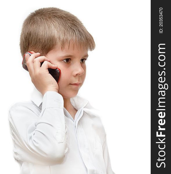 A boy with a cell phone. Isolated on white background