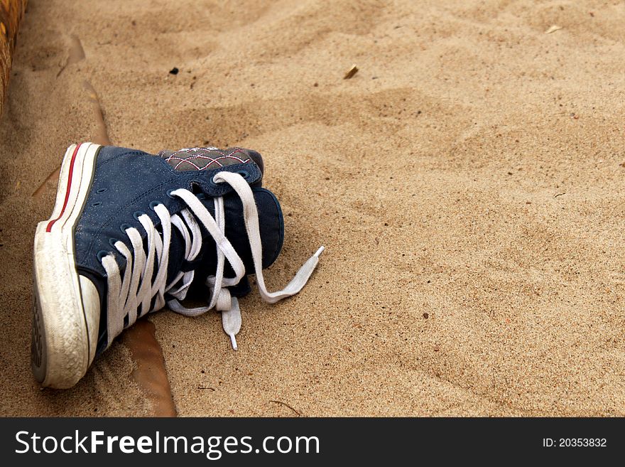 A sneaker in the sand
