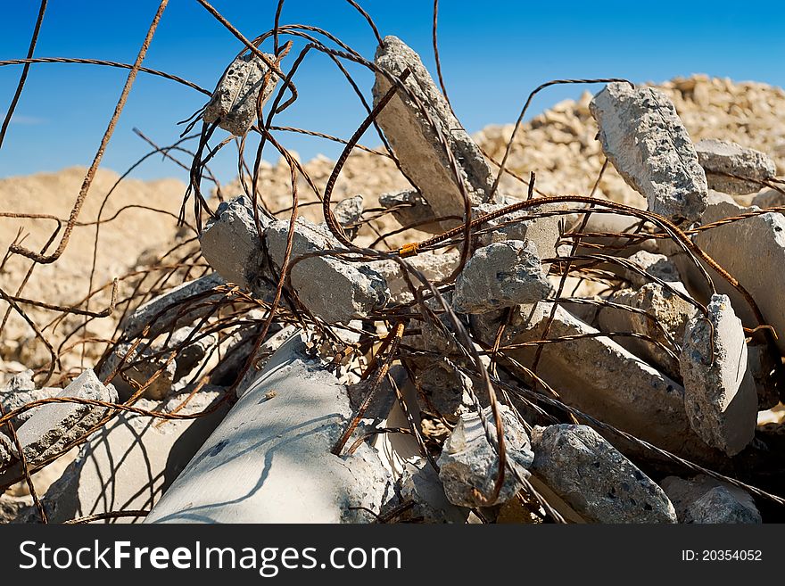 Ruined concrete pillar with rusty wires. Ruined concrete pillar with rusty wires