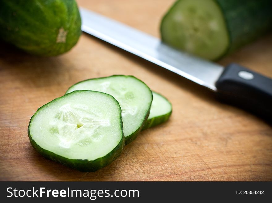 Closeup ripe vegetables lies on hardboard with knife. Closeup ripe vegetables lies on hardboard with knife