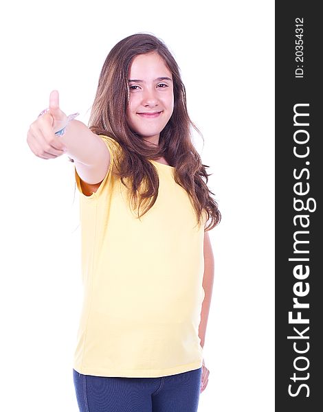 Beautiful and young teenage girl doing thumb up