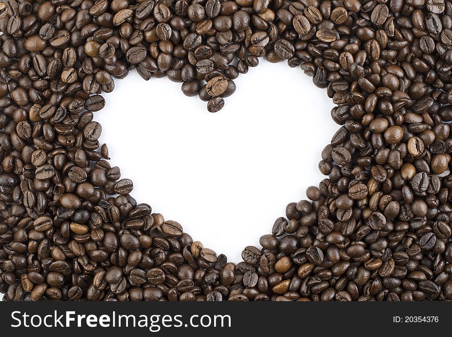 Coffee beans forming shape of heart. Coffee beans forming shape of heart