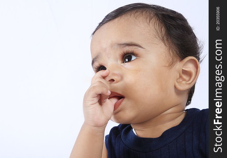 Indian Cute Baby Sucks on His Fingers. Indian Cute Baby Sucks on His Fingers