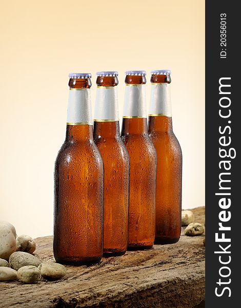 Four Cold Beer Bottles orange gradient background