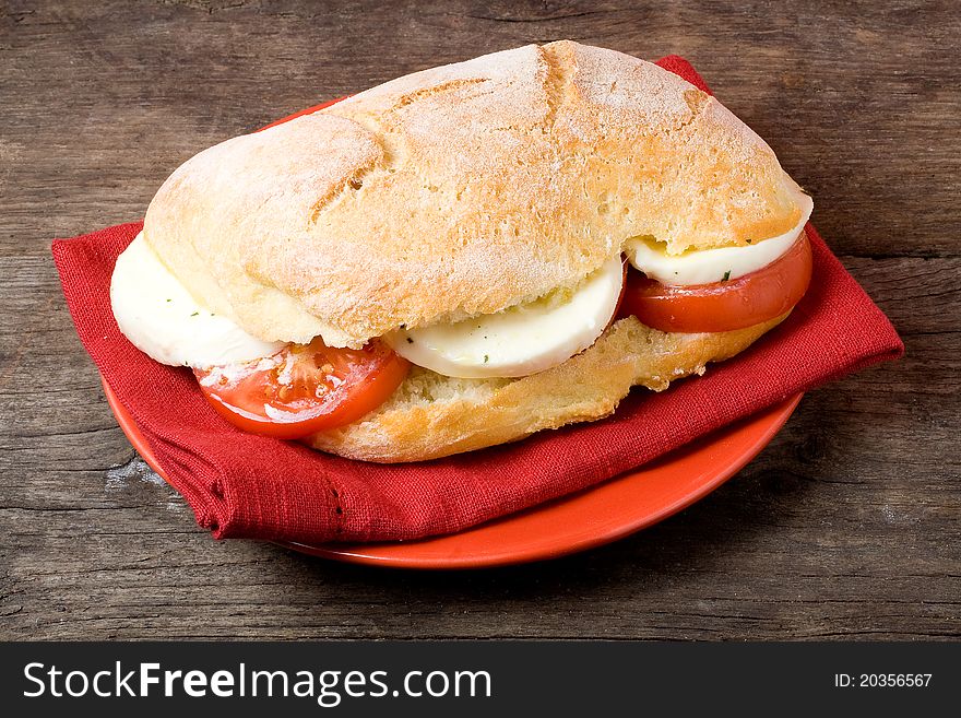 Sandwich caprese with mozzarella and tomato slice