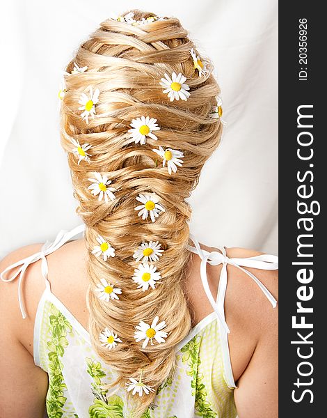 Flower hairdress of the girl on a white background