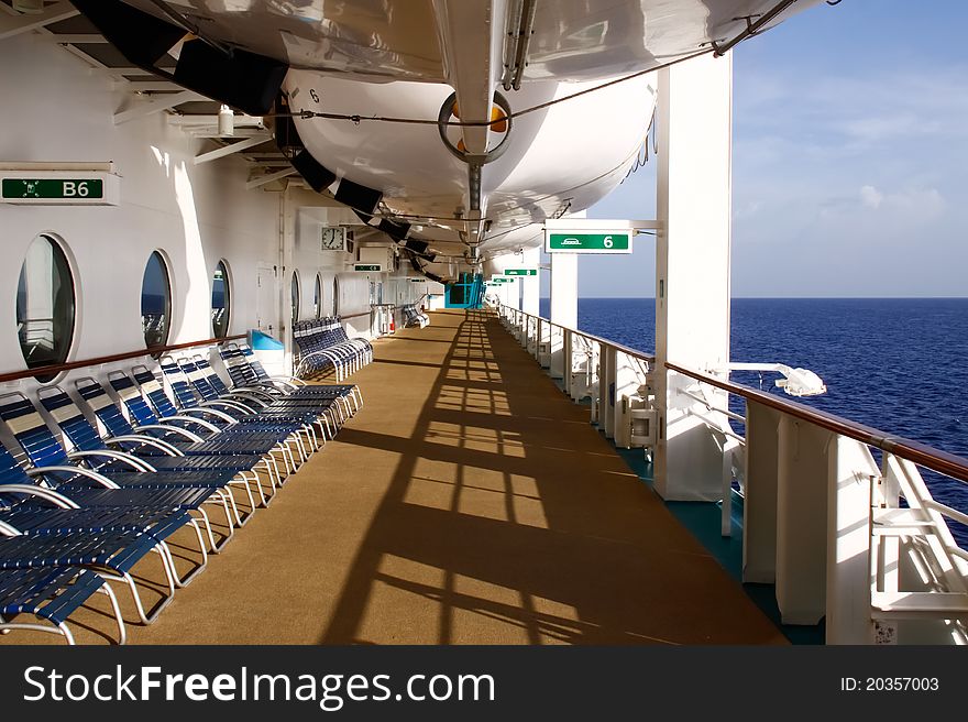 Empty lounge chairs tempt world weary passengers to find some peace and quiet and relax and soak up the Caribbean sun as they lay out in lounge chairs on the deck of Royal Caribbean's Serenades of the Seas. Empty lounge chairs tempt world weary passengers to find some peace and quiet and relax and soak up the Caribbean sun as they lay out in lounge chairs on the deck of Royal Caribbean's Serenades of the Seas.