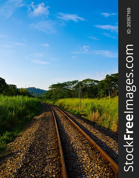 A railway track cutting through the countryside. A railway track cutting through the countryside