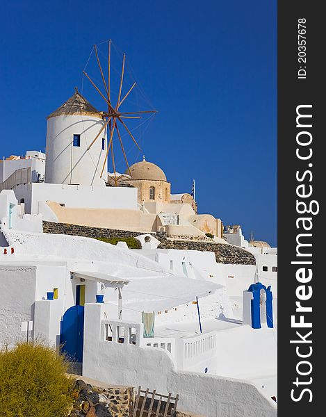 Windmill In Oia At Santorini Island, Greece