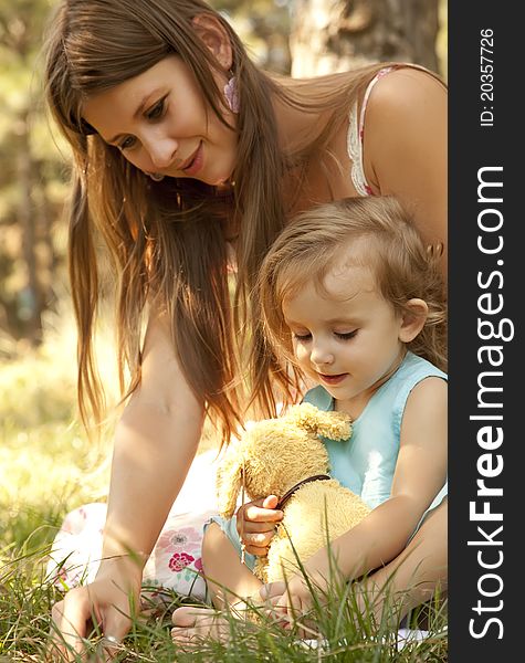 Little girl and mother in the park.