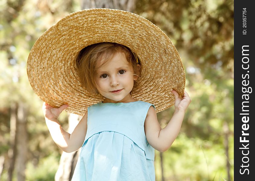 Cute little girl smiling in a park