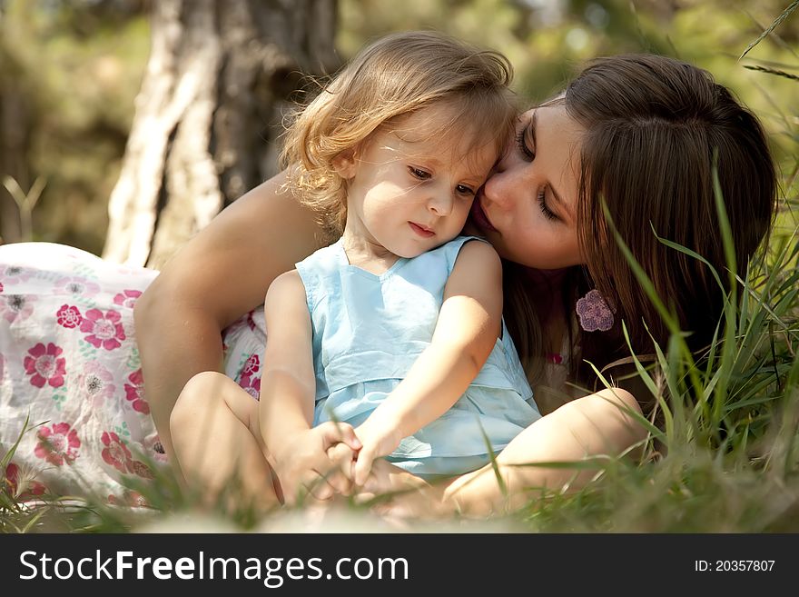 Little girl and mother in the park